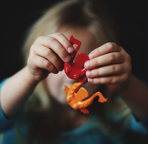 Close-up of girl holding toys