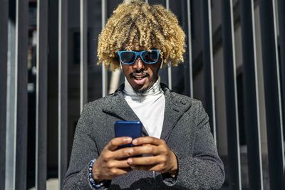 Young man using mobile phone