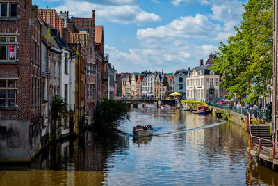 Boat on canal in city