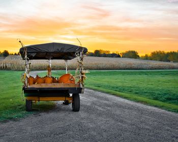 View of agricultural field against sky during sunset