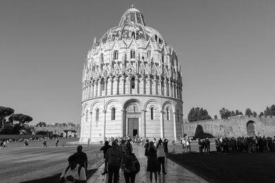 Group of people in front of historical building