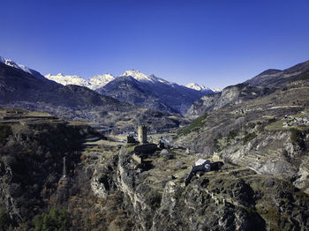 Scenic view of mountains against clear sky in aosta valley 