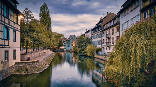View of the old buildings on the riverbanks reflecting on the water,  petite france, strasbourg
