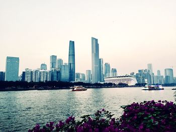 Scenic view of river and city against clear sky