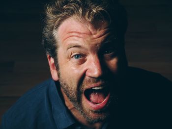 Portrait of mid adult man screaming