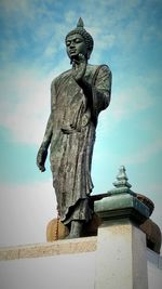 Low angle view of statue against sky