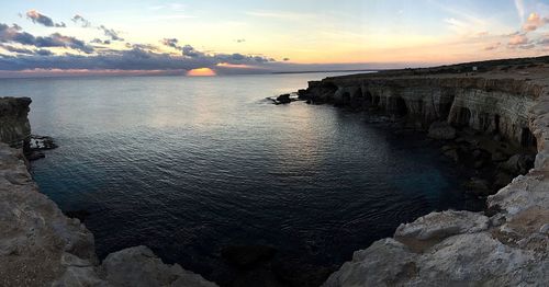 Scenic view of sea at sunset