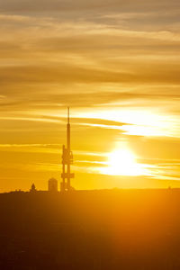 Silhouette building against sky during sunset