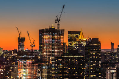 Silhouette of cityscape at sunset