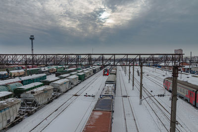 High angle view of train at railroad station against sky