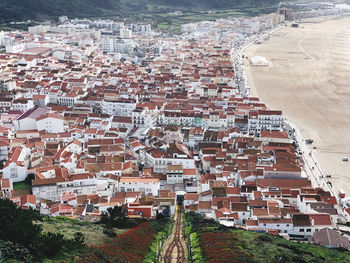 The top view of nazare, small city of portugal, surf spot, yellow roofs of the buildings