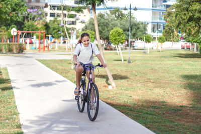 Man riding bicycle on road