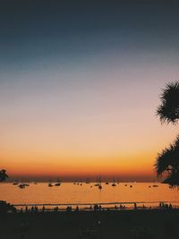 Scenic view of sea against clear sky during sunset