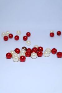 Close-up of colored pencils over white background