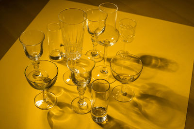 Close-up of wine glasses on table