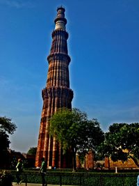 Low angle view of tower against clear blue sky