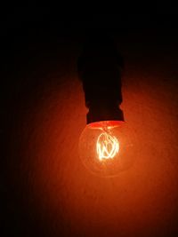 Close-up of illuminated light bulb