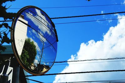 Low angle view of cables against blue sky