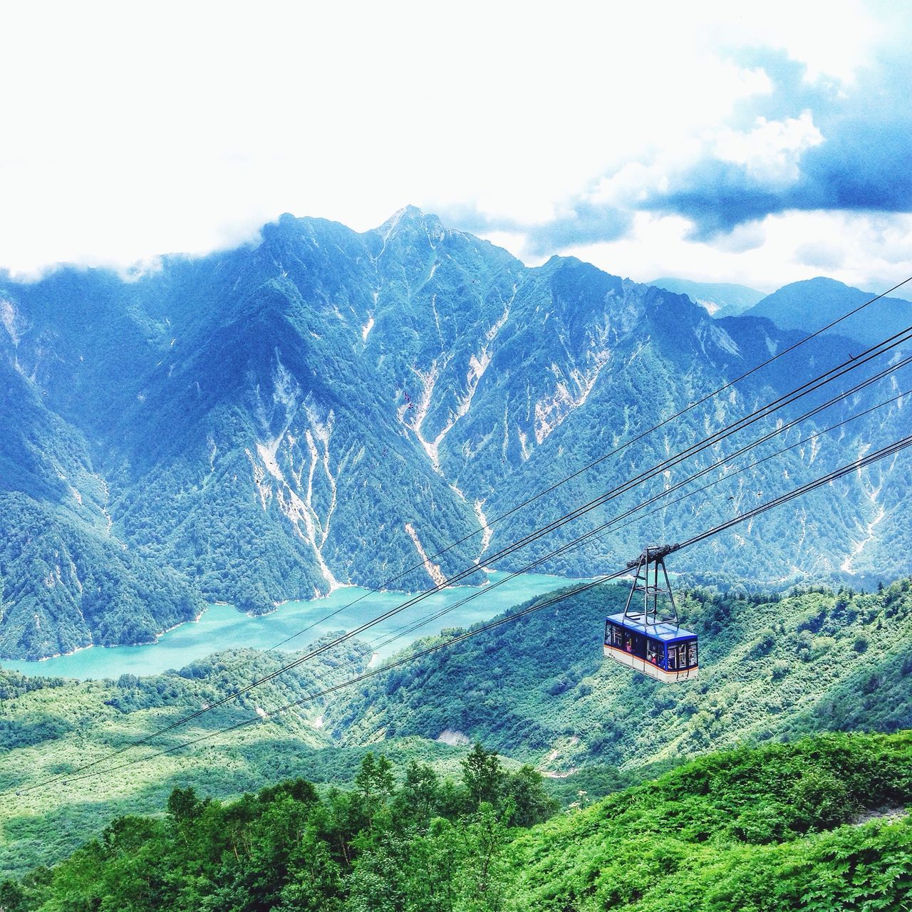 mountain, transportation, mountain range, scenics, tranquil scene, landscape, mode of transport, beauty in nature, sky, high angle view, nature, tranquility, overhead cable car, connection, non-urban scene, water, river, day, travel, weather