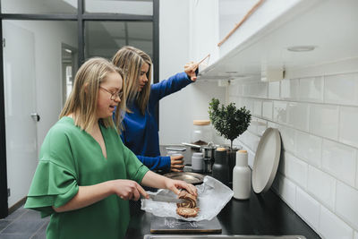 Mother with daughter in kitchen