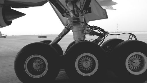 Close-up of motorcycle against sky