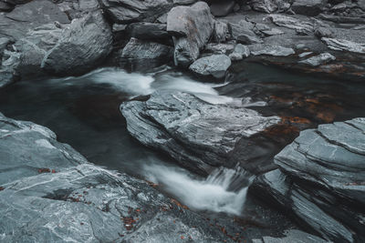 Water flowing through rocks in sea