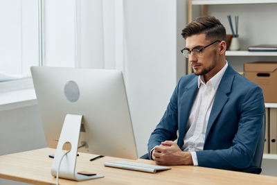 Businessman working at desk in office