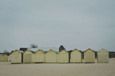 Built structure on beach against clear sky