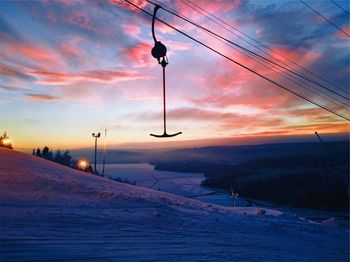 Overhead cable car against sky during winter