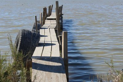 Wooden posts in lake