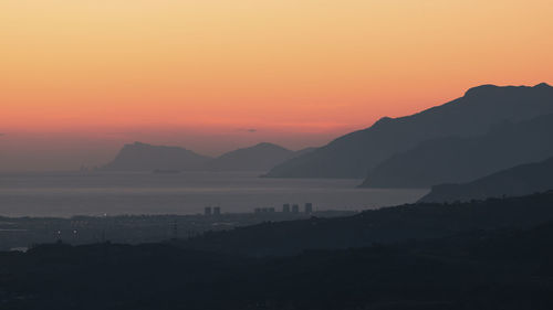 Top view of salerno at sunset and in the background the amalfi coast and the capri stacks