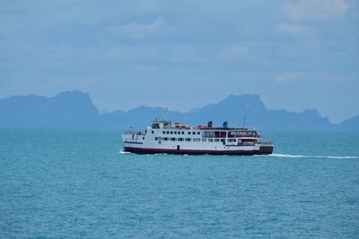 Ship sailing on sea against sky