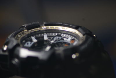 High angle view of clock on black background