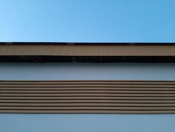 Low angle view of building against blue sky