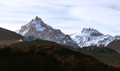 Scenic view of snowcapped mountains against sky