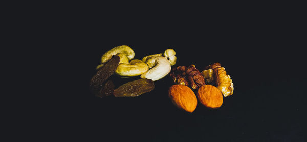 Close-up of fruits against black background