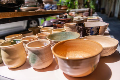 Close-up of coffee crockery on table for sale