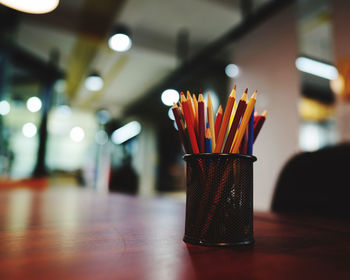 Close-up of multi colored pencils on table