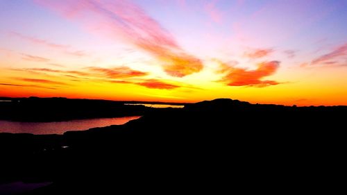 Scenic view of dramatic sky over sea during sunset