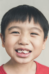 Close-up portrait of smiling boy