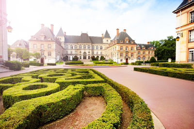 View of garden with buildings in background