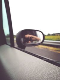 Close-up of reflection on side-view mirror