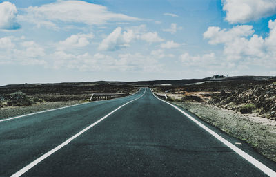 Surface level of empty road along landscape