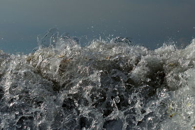 Close-up of sea splashing water