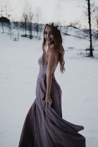 Portrait of young woman in snow