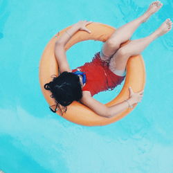 High angle view of woman swimming in pool