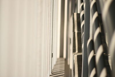 Close-up of sunlight passing through blinds on steps