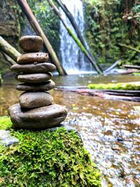 Close-up of pebbles in water
