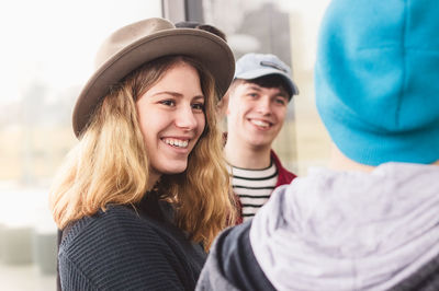 Happy friends discussing outdoors