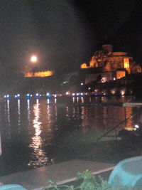 Reflection of illuminated buildings in water